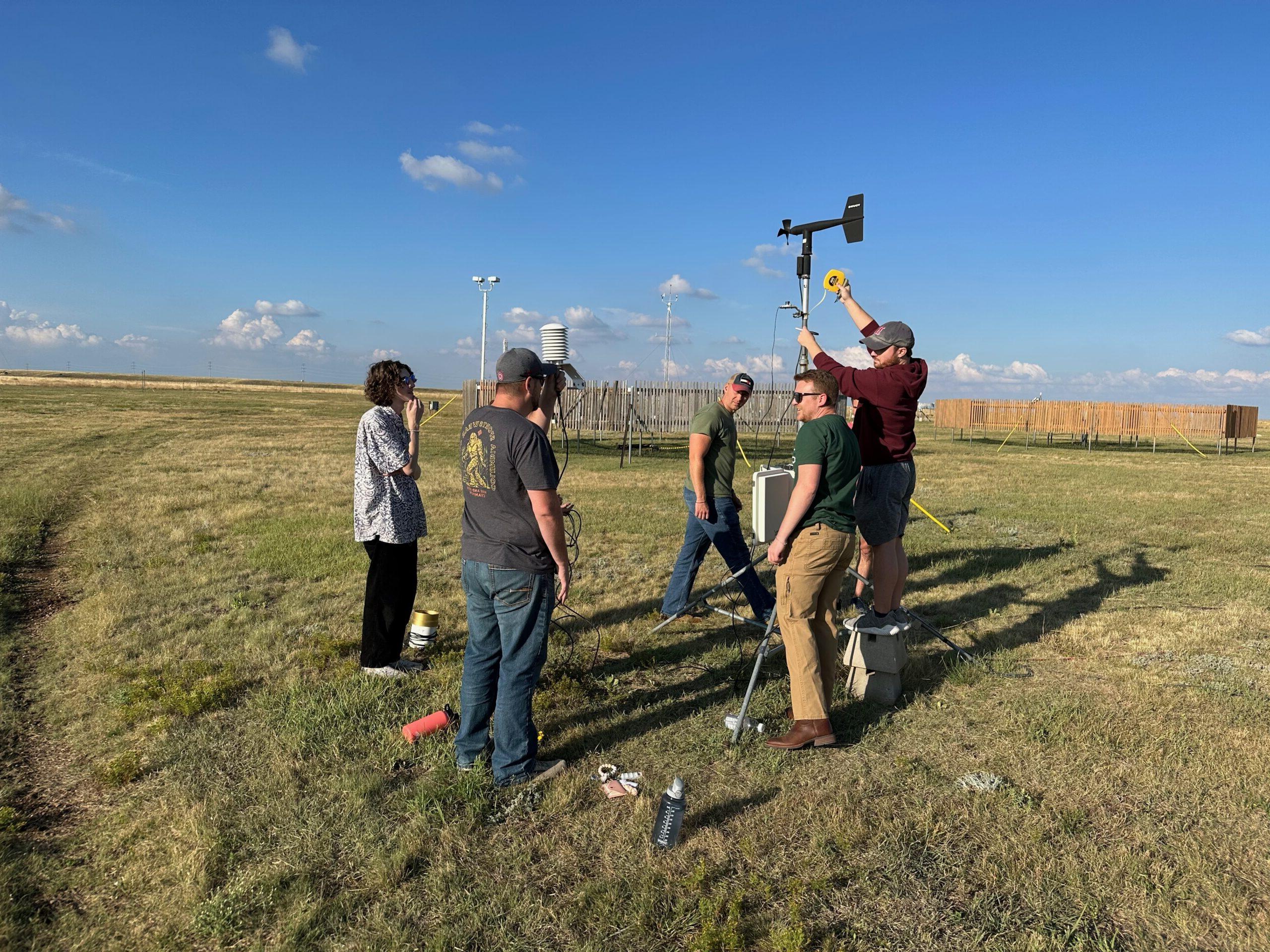 Students at Marshall Mesa installing a weather instrument.